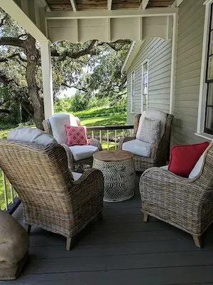 Guests gathering on the front porch at Round Top Inn